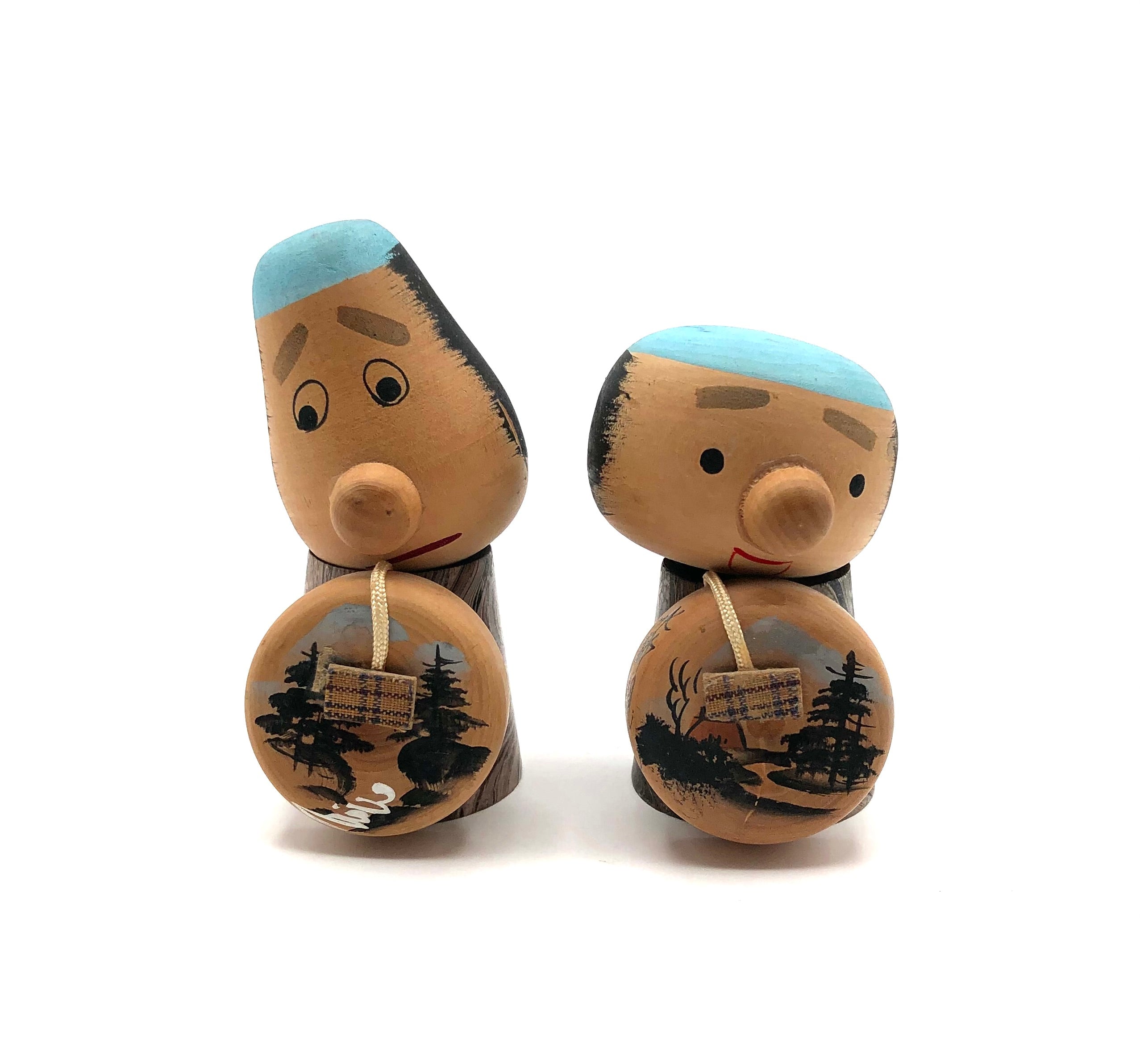 Pair of Vintage Sosaku Kokeshi entitled: “Yajirobē and Kitahachi | Tōkaidōchū Hizakurige ”
